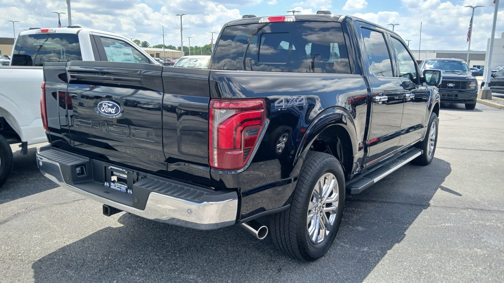 Black pickup truck rear and side view with 4x4 badge