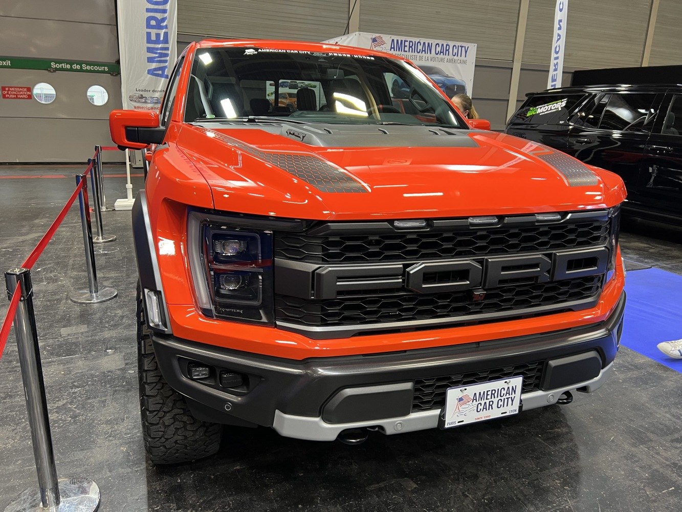 Bold grille and distinctive LED headlights on a pickup truck front