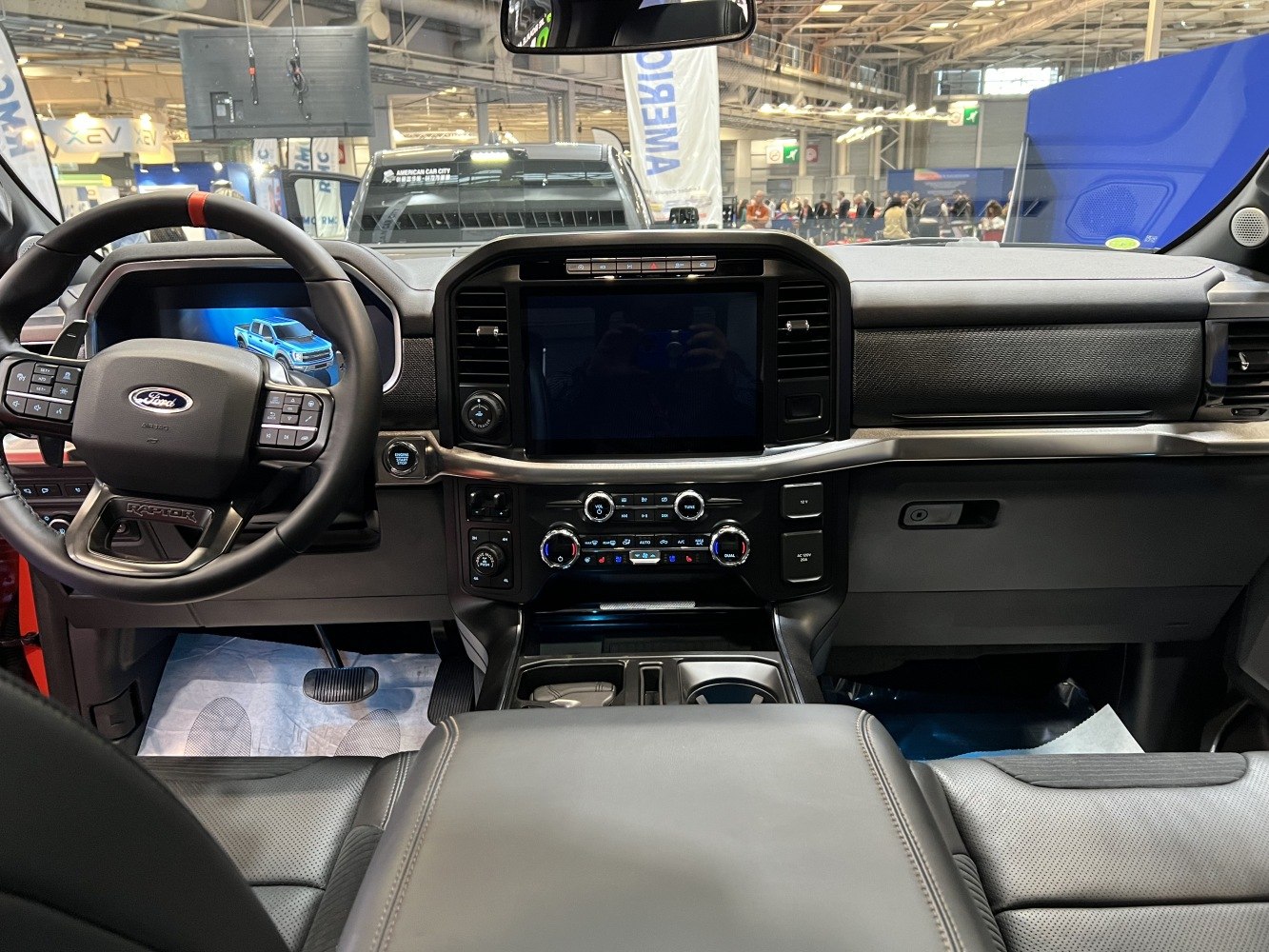 Modern dashboard and multifunction steering wheel with touchscreen in truck interior