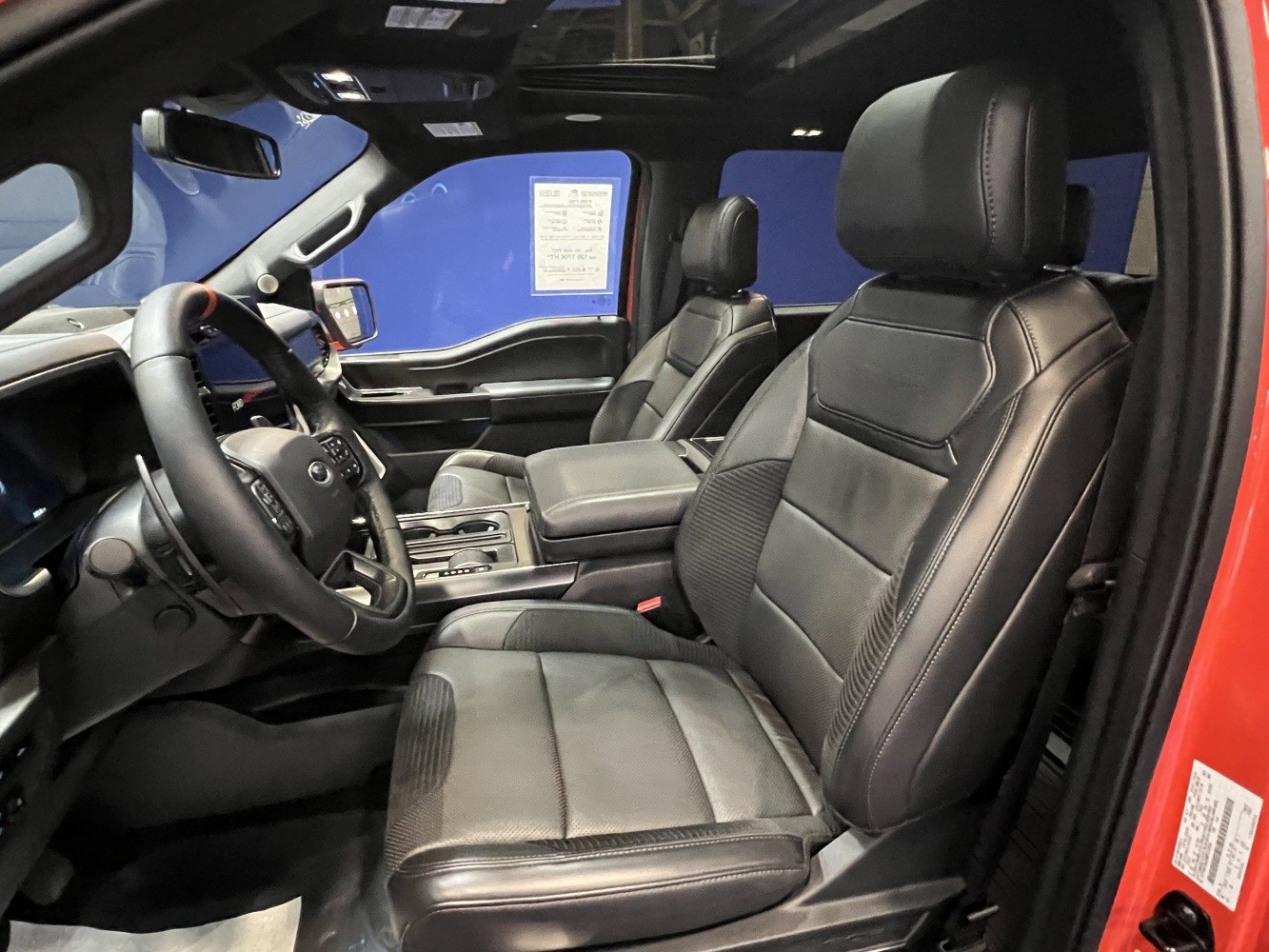 Black leather seats and modern dashboard with center console