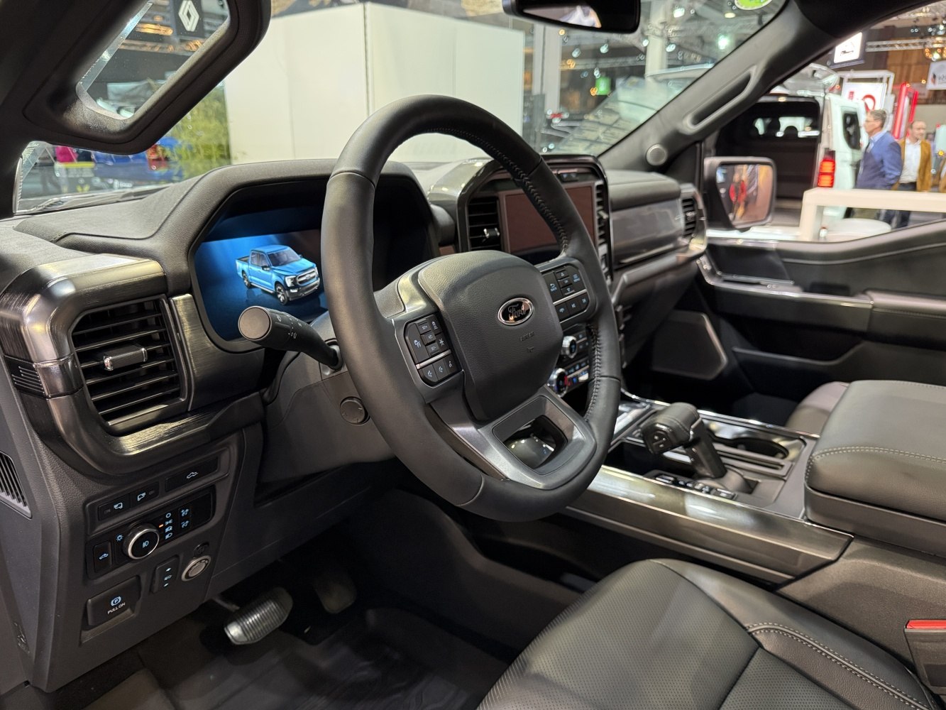 Modern truck interior with digital dashboard and multifunction steering wheel