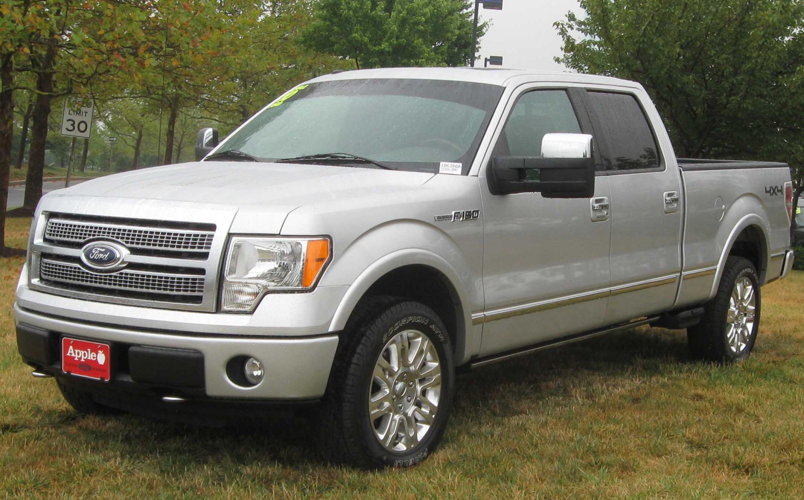 Silver pickup truck with crew cab and chrome wheels