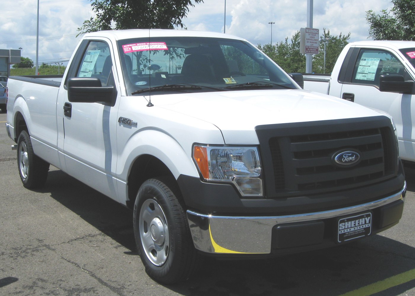Single cab pickup with black grille and chrome front bumper