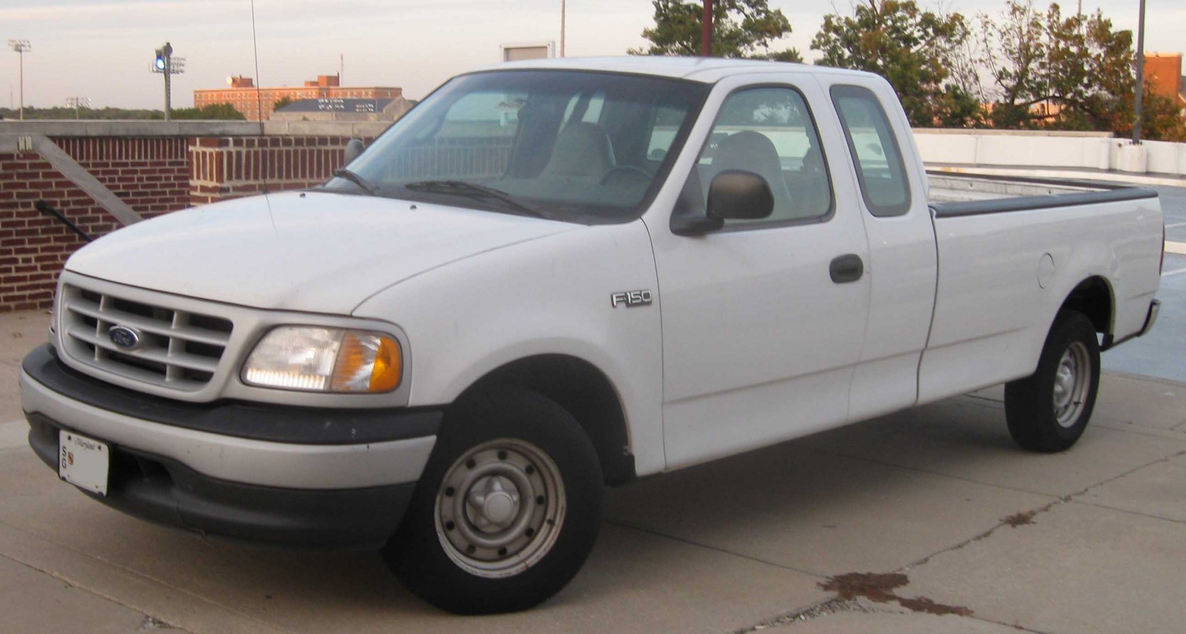 White extended cab pickup truck with spacious bed and utilitarian design