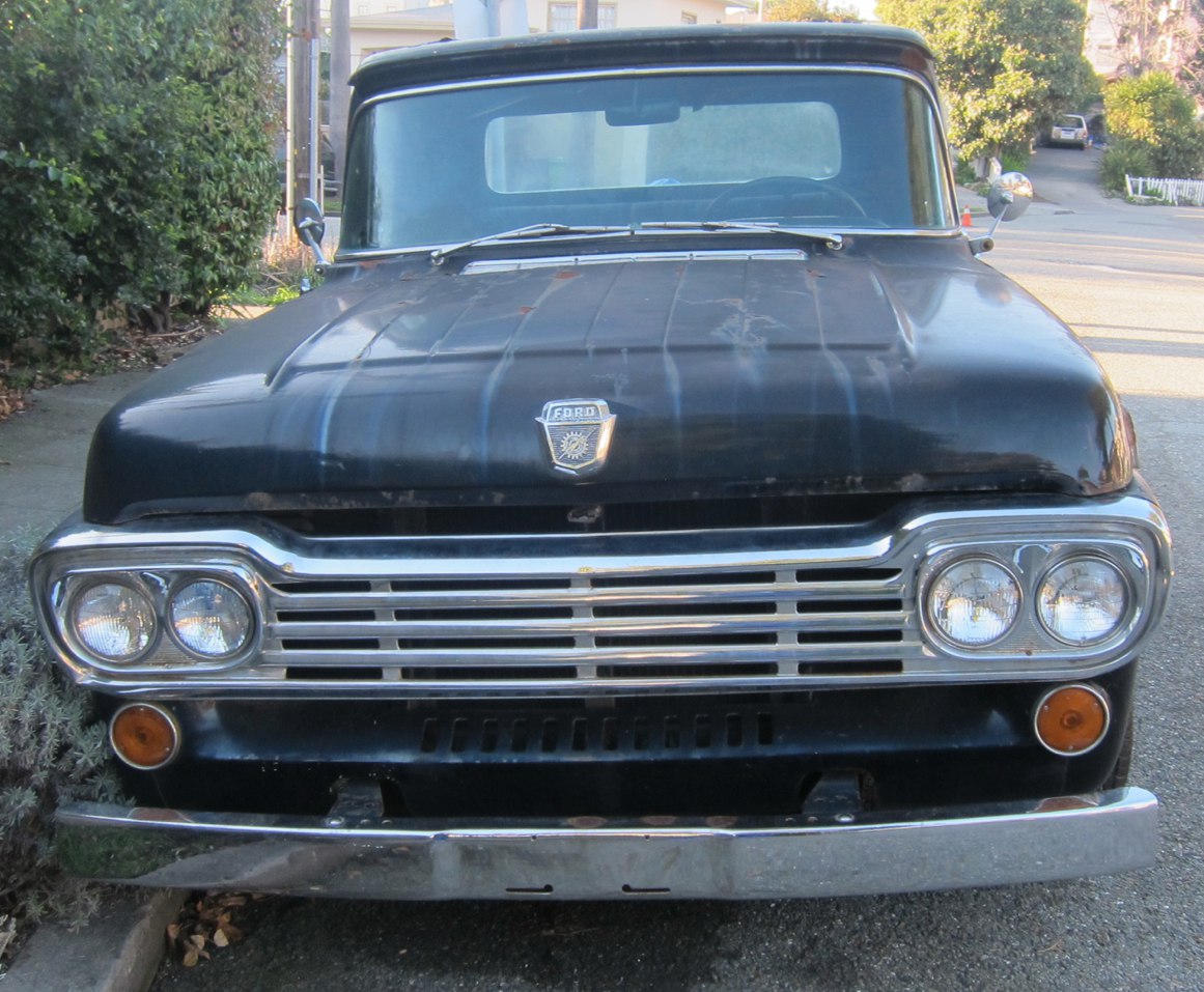 Classic truck front view with twin round headlights and chrome grille