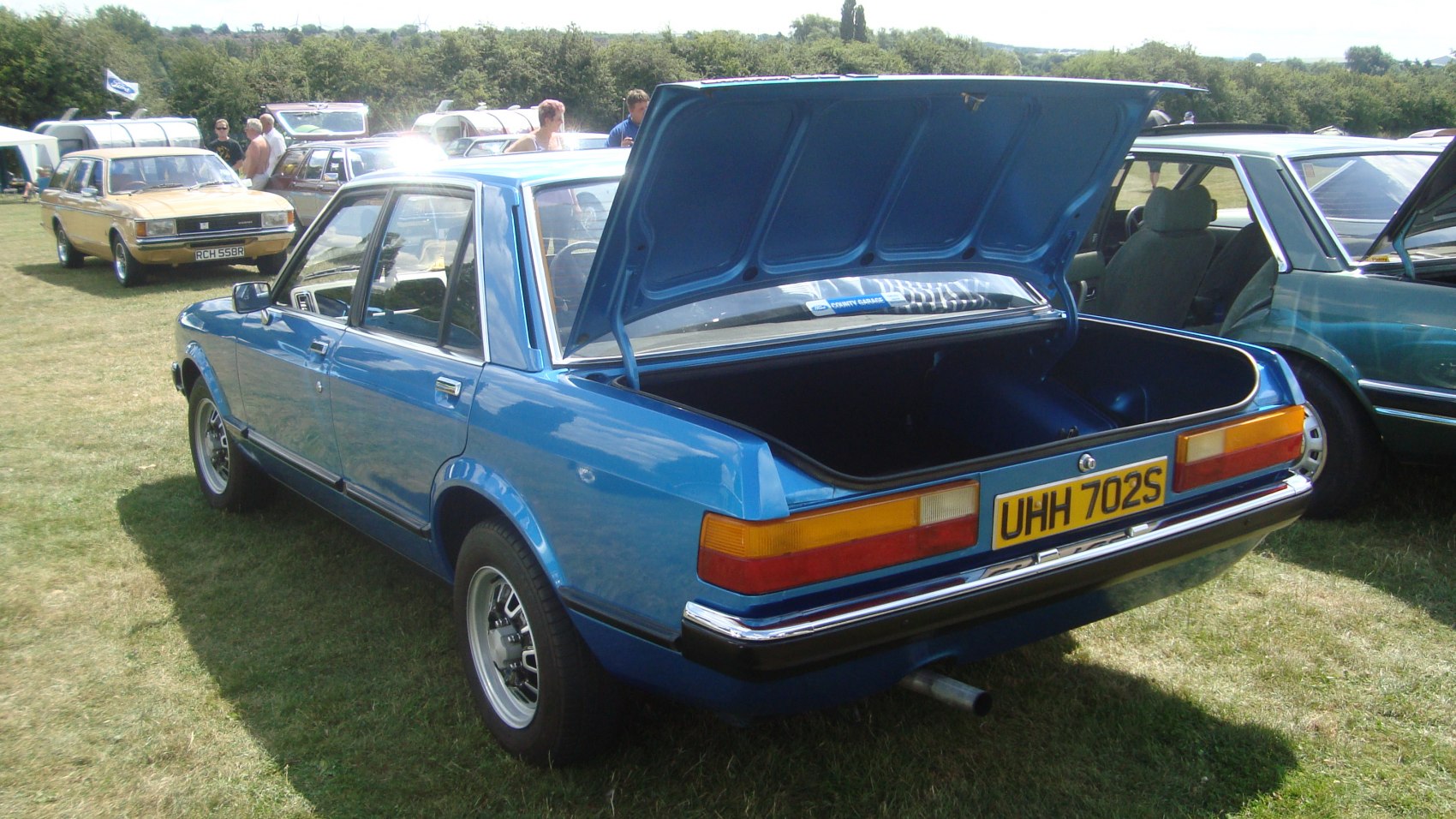Rear view with open trunk of classic sedan