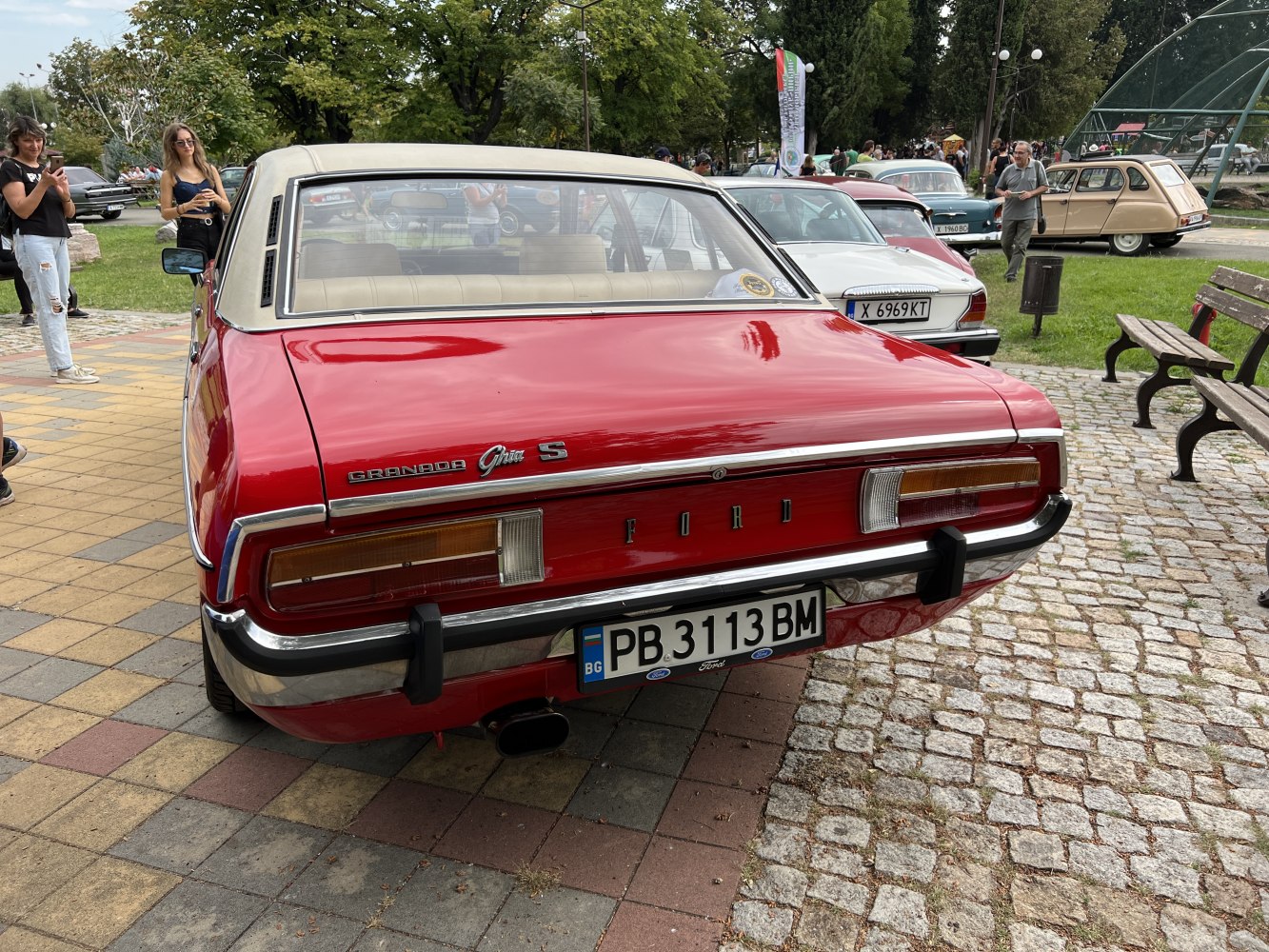 Vintage car rear view with distinctive taillights and chrome bumper