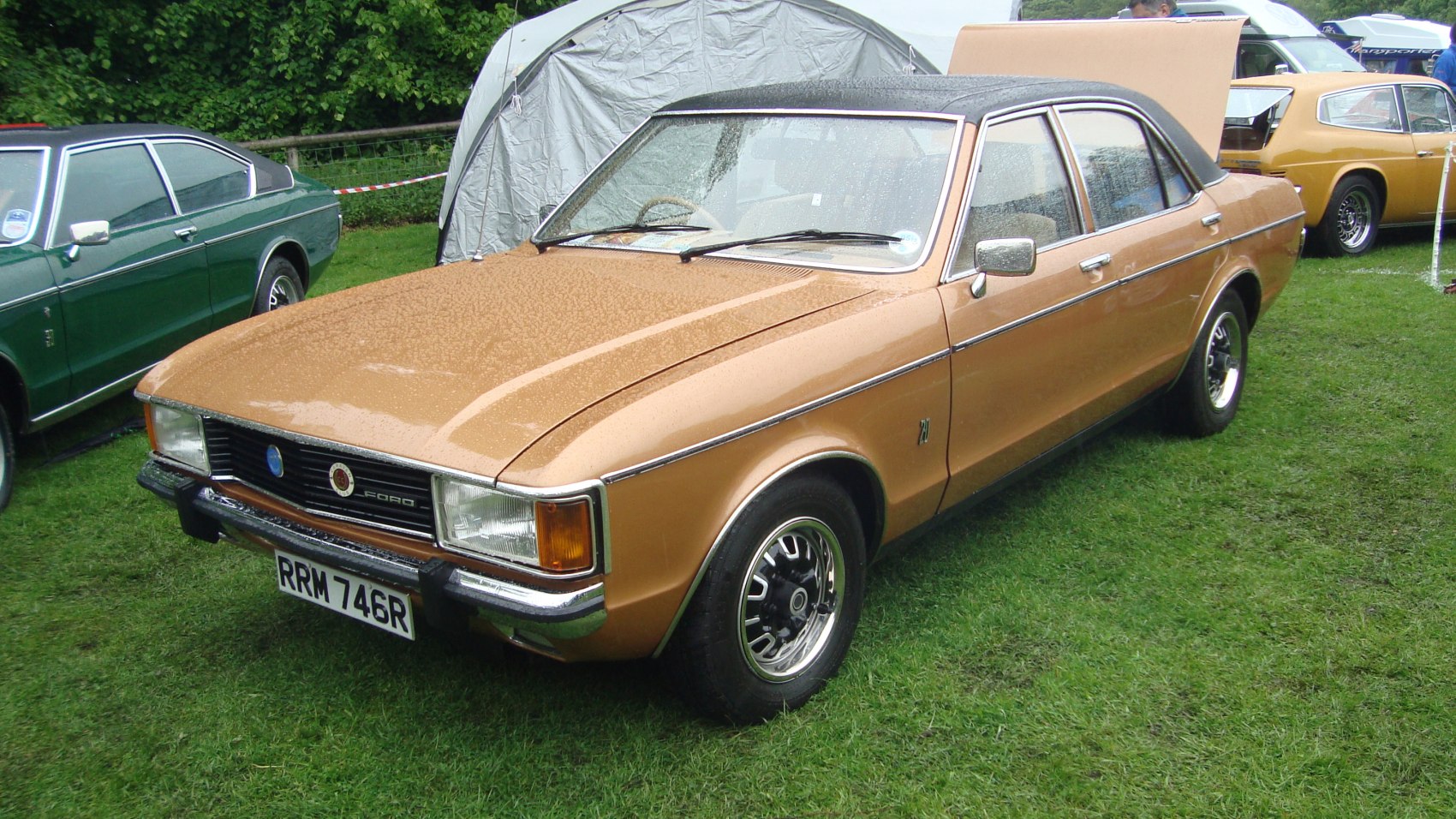 1970s vintage sedan with vinyl roof and retro wheels