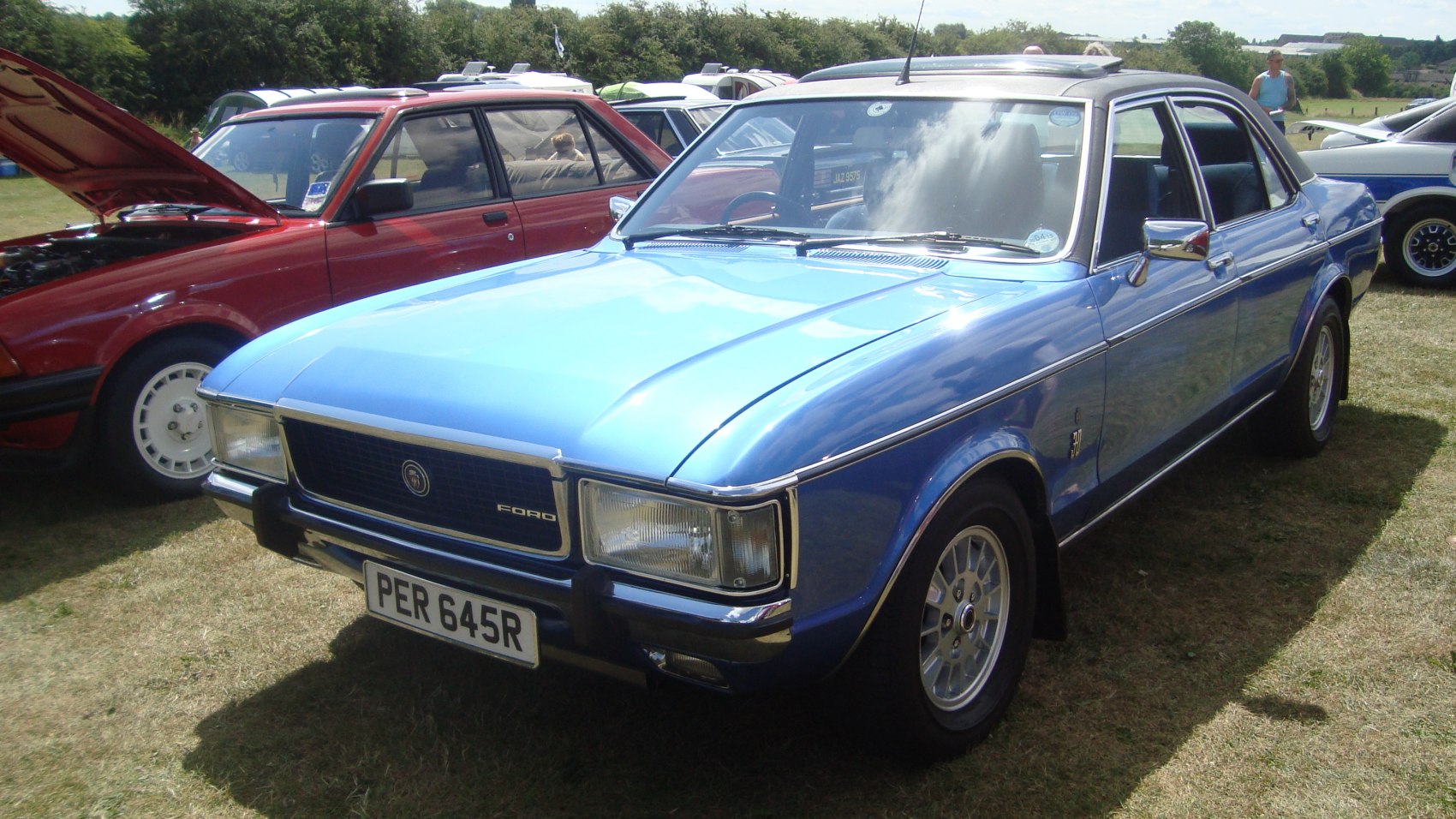Vintage sedan with blue metallic finish and chrome details