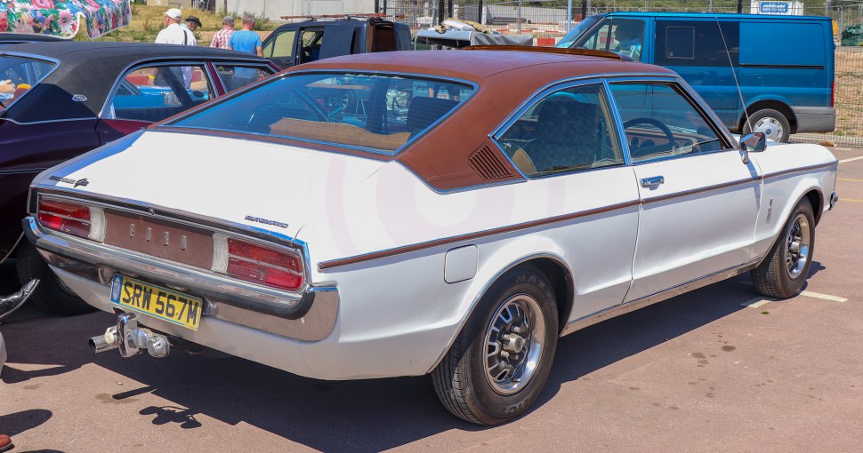 Rear view of classic vintage coupe with brown vinyl roof
