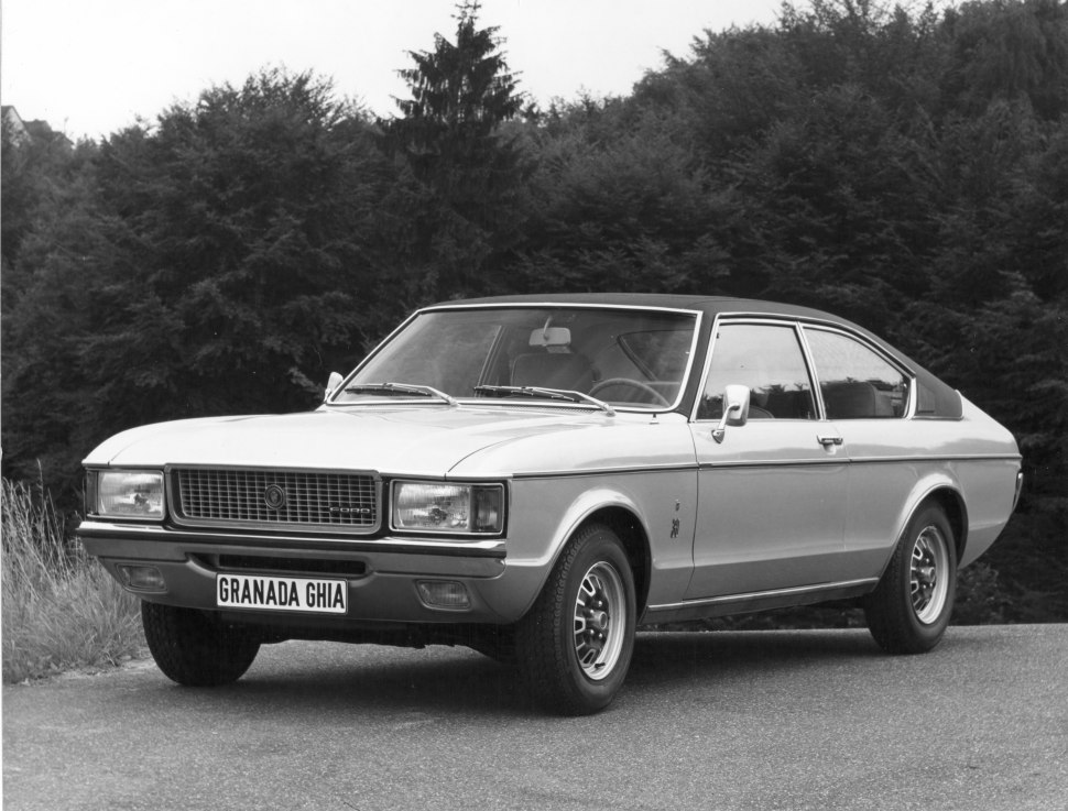 Front side view of vintage two-door coupe with distinctive grille