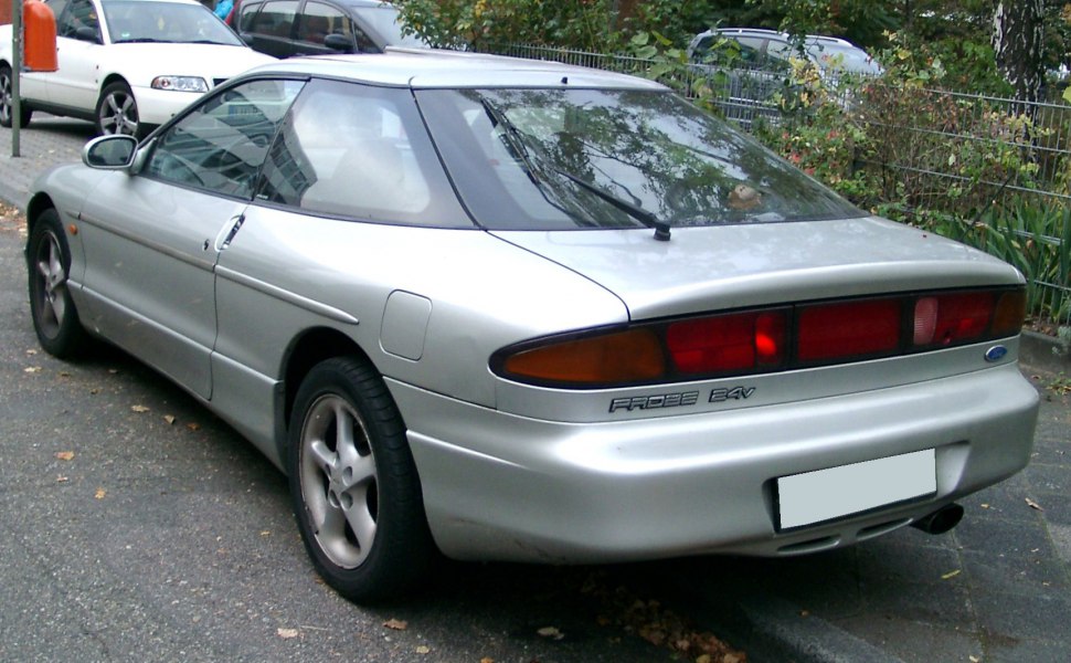 Rear view of sport coupe with distinctive taillights and integrated spoiler