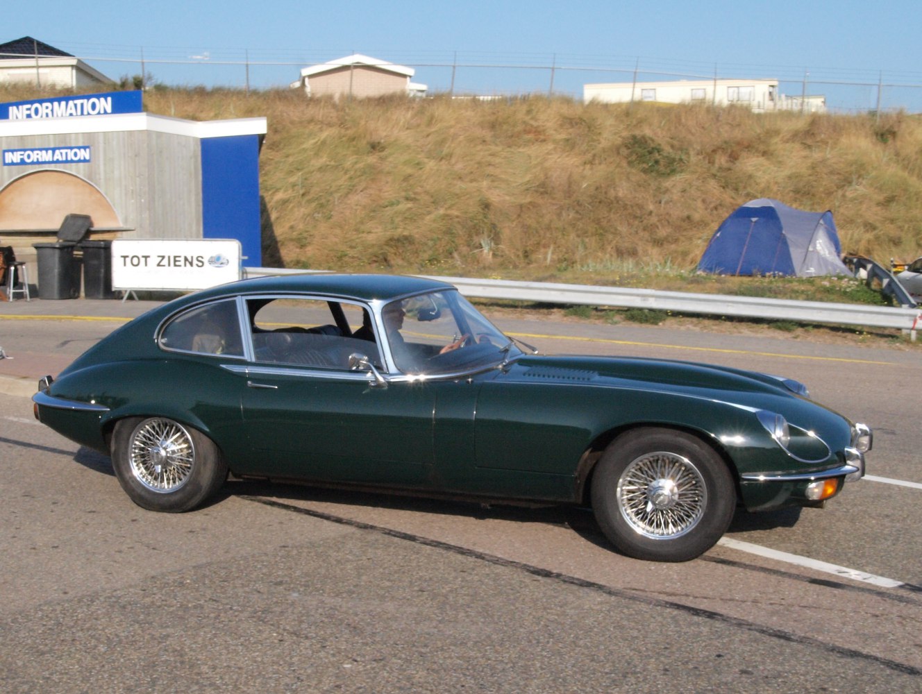 Wire spoke wheels and sleek fastback coupe body