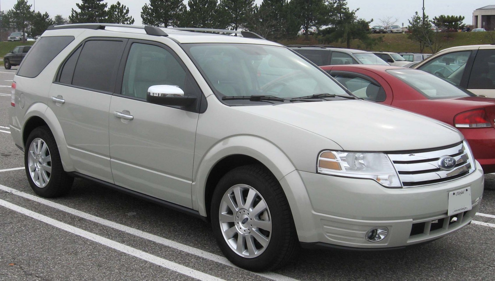 Front-side view of a spacious mid-size SUV with roof rails and alloy wheels.
