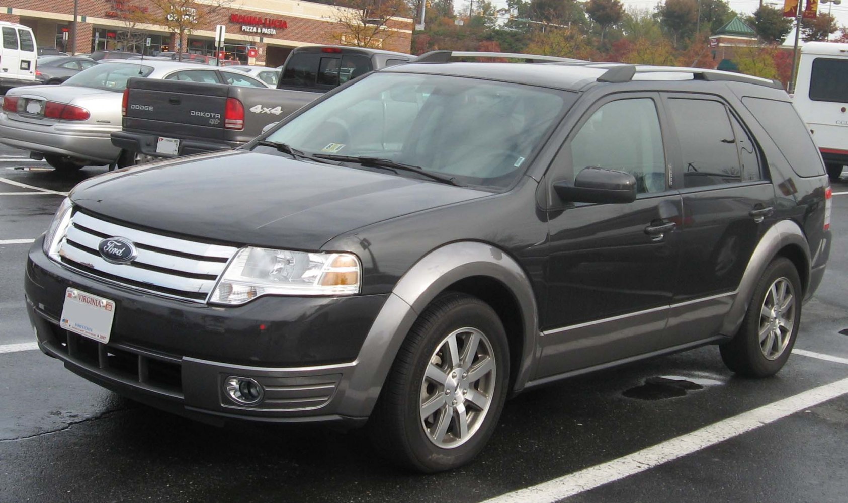 SUV with chrome grille, roof rails, and alloy wheels