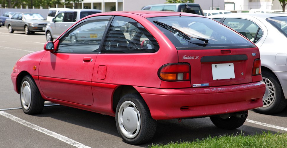 Rear and side view of a 3-door compact hatchback with rounded taillights.
