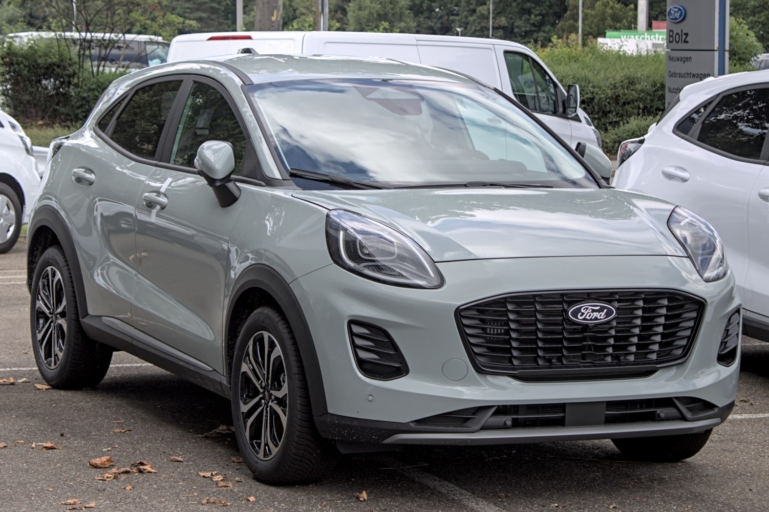 Front and side view with LED headlights and modern grille