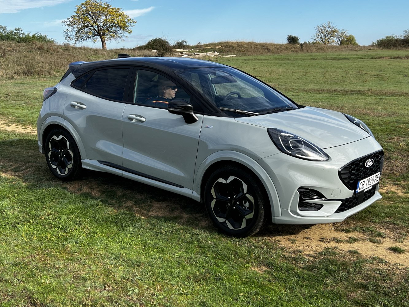 Compact SUV front side with sleek headlights and unique alloy wheels