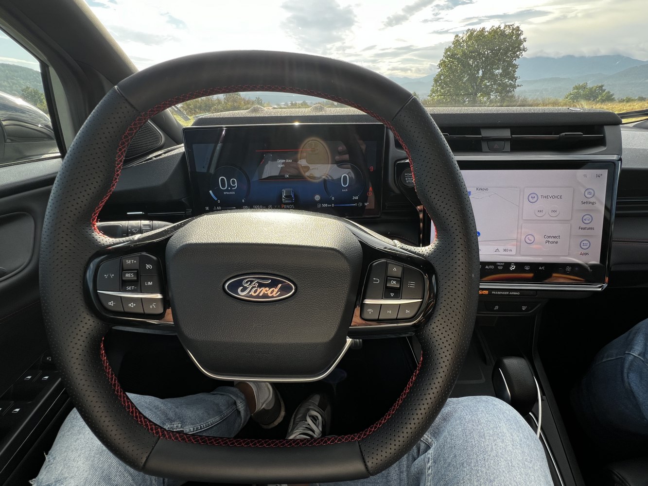 Digital instrument cluster and central touchscreen in modern vehicle interior