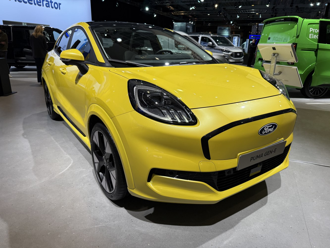 Yellow compact crossover front with LED headlights and aerodynamic design