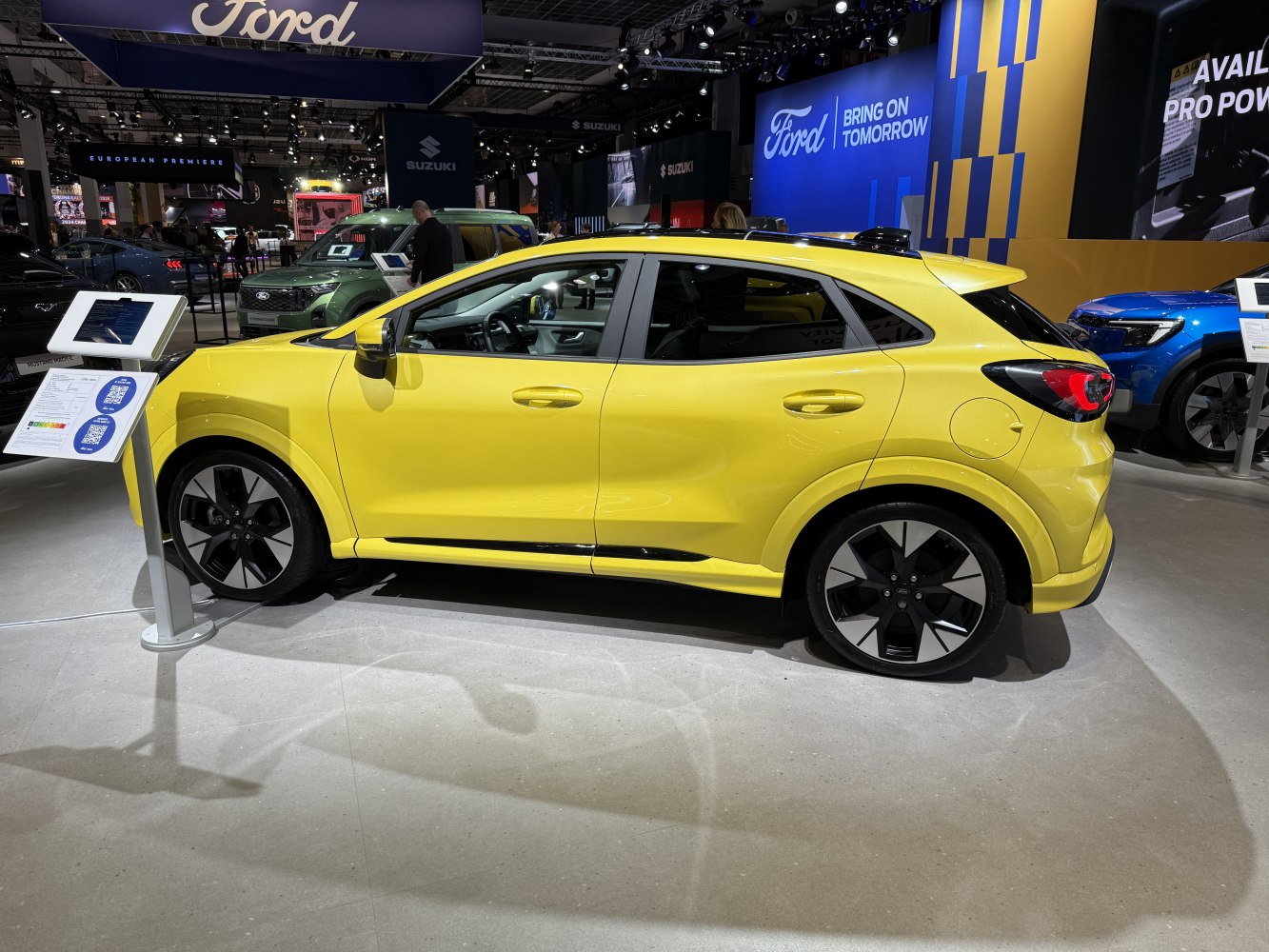 Yellow compact SUV side view with black-silver alloy wheels