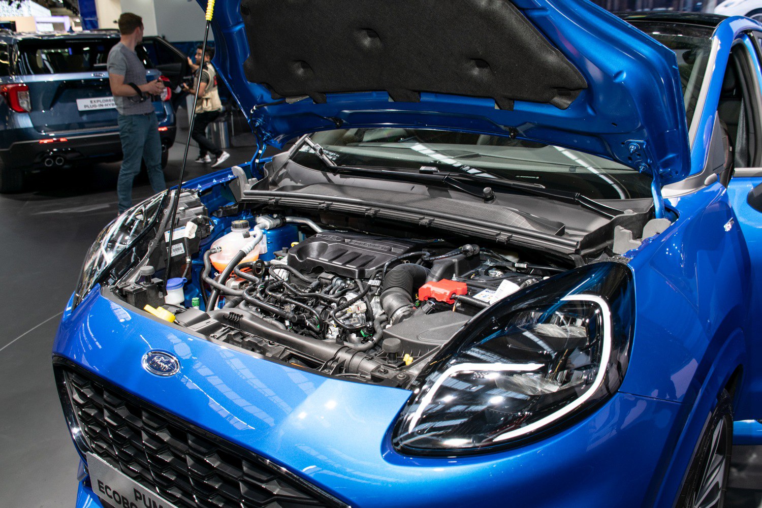 Open engine bay and LED headlights of a compact crossover