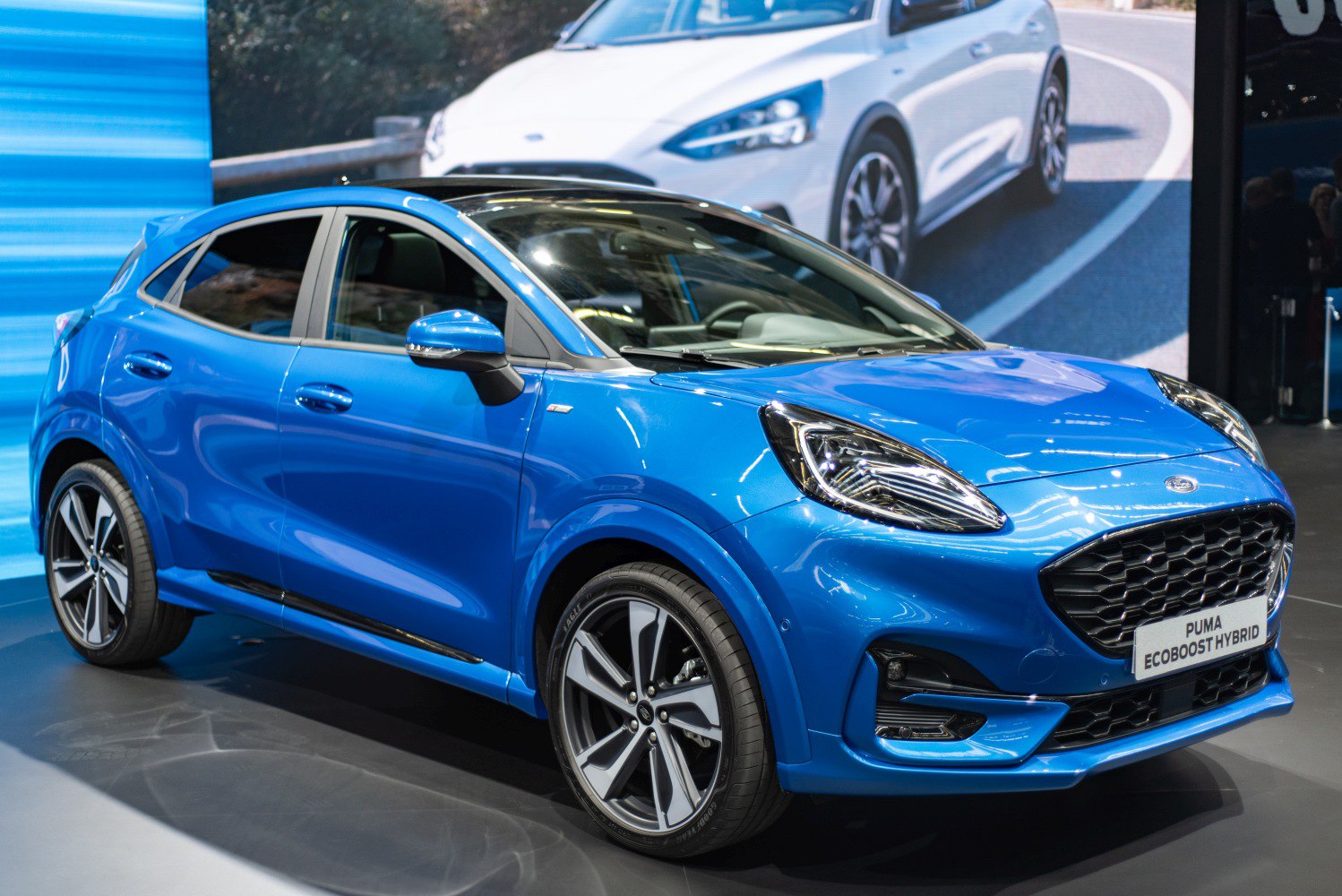 Blue compact SUV with sporty alloy wheels and LED headlights