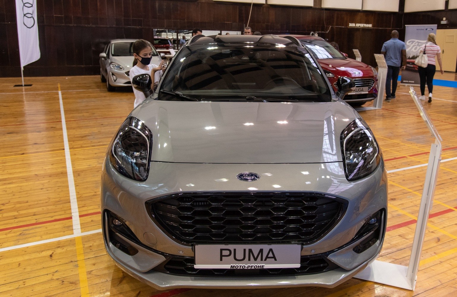 Front view of a compact vehicle with hexagonal grille and modern sleek headlights