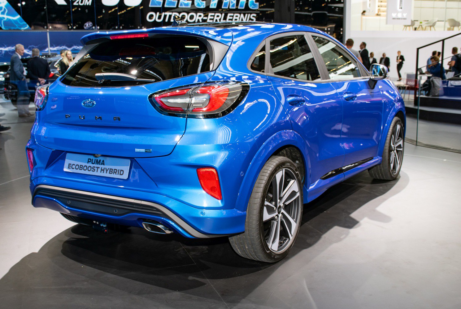 Rear and side view of blue hybrid crossover with LED taillights and alloy wheels