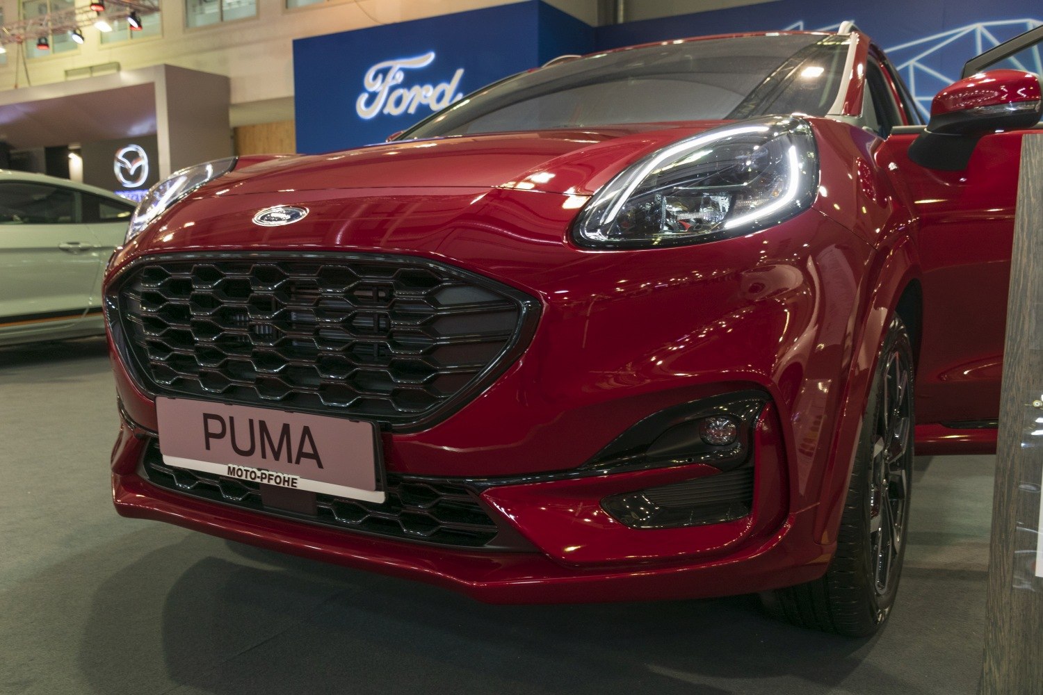 Close-up of front grille and LED headlight