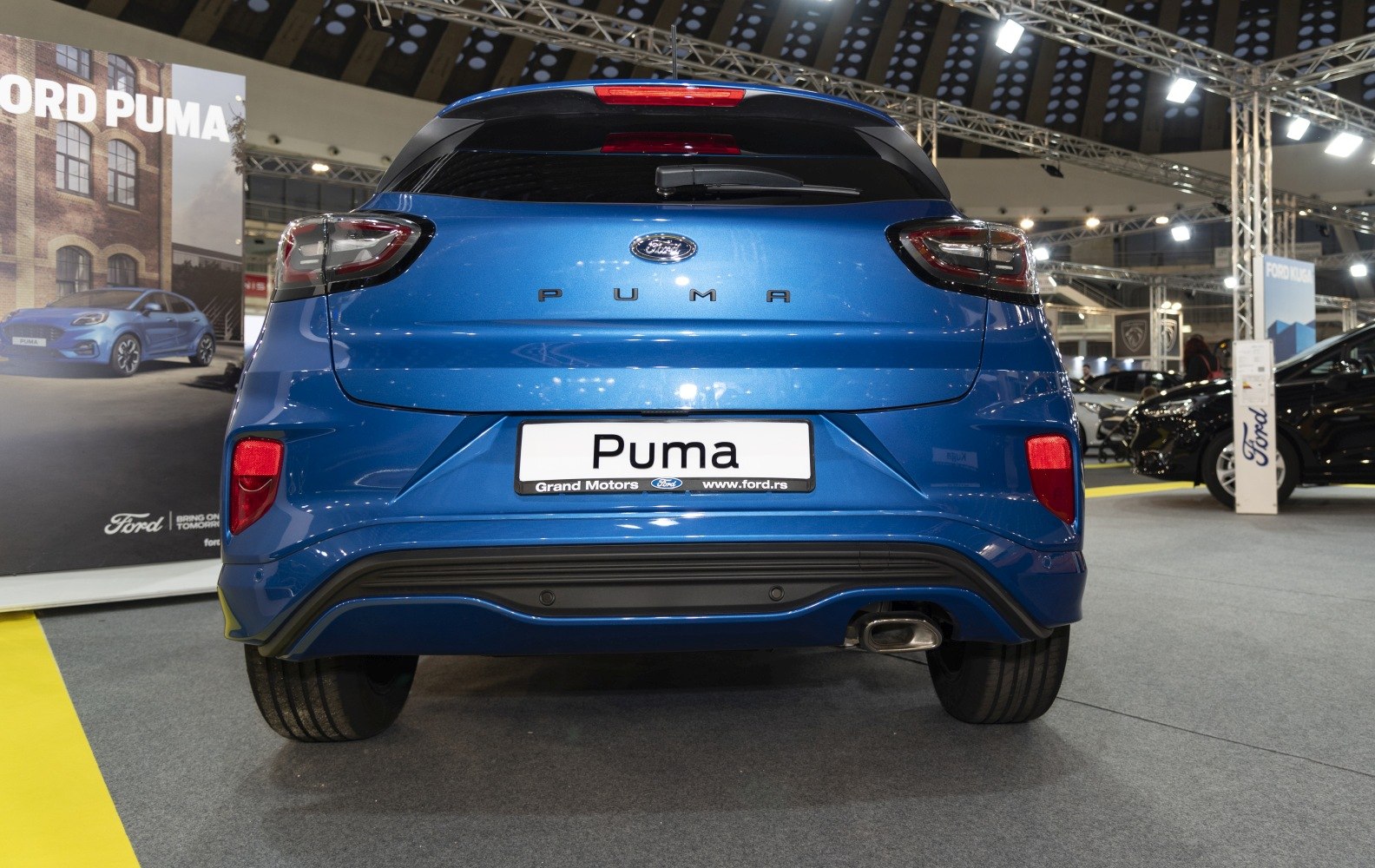 Modern SUV rear with distinct taillights and single exhaust