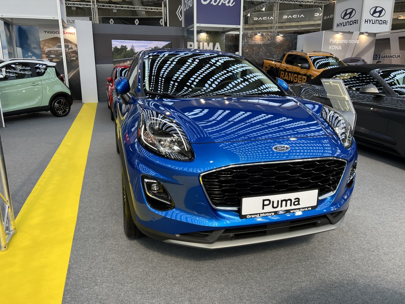 Front view with prominent grille and sleek headlights