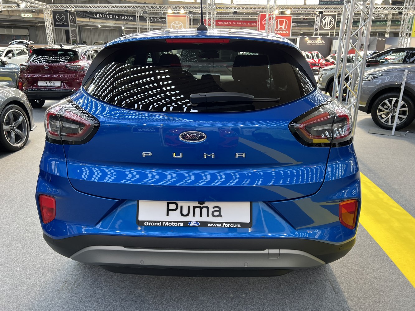 Rear view with modern taillights and bold bumper design