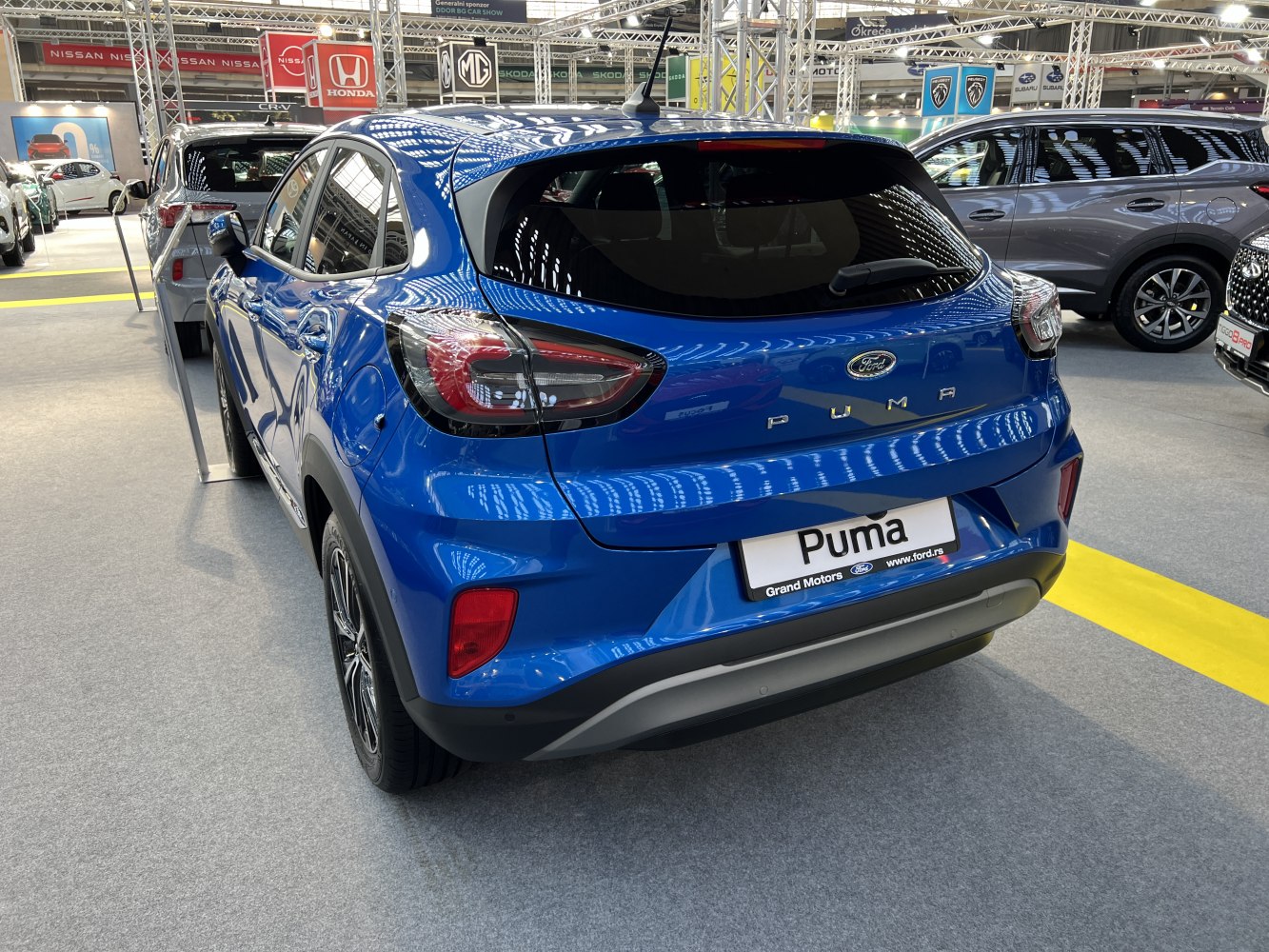 Rear view featuring distinctive taillights and rear badge on a modern crossover.