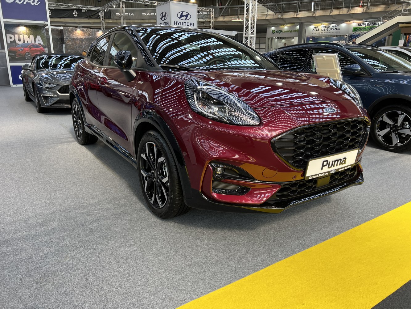 Front view of a compact crossover with LED headlights and alloy wheels