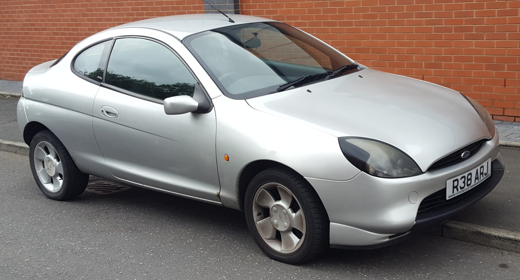 Silver compact coupe front and side view with alloy wheels