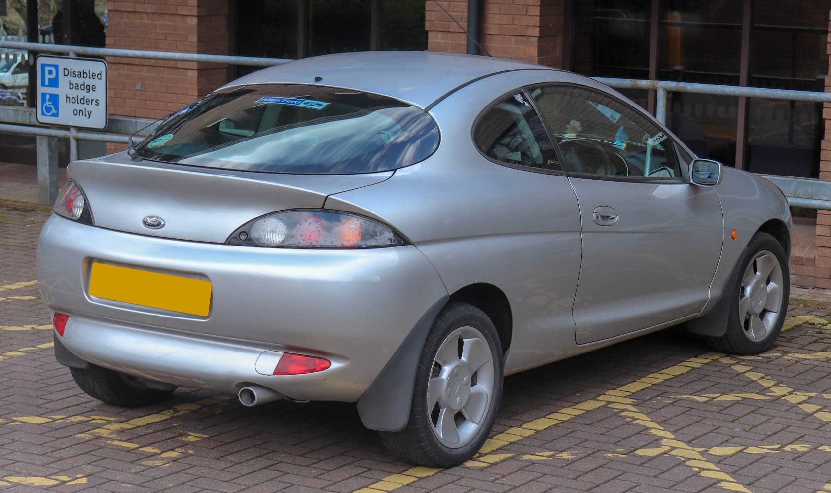 Smooth rounded rear and side view with distinctive tail lights