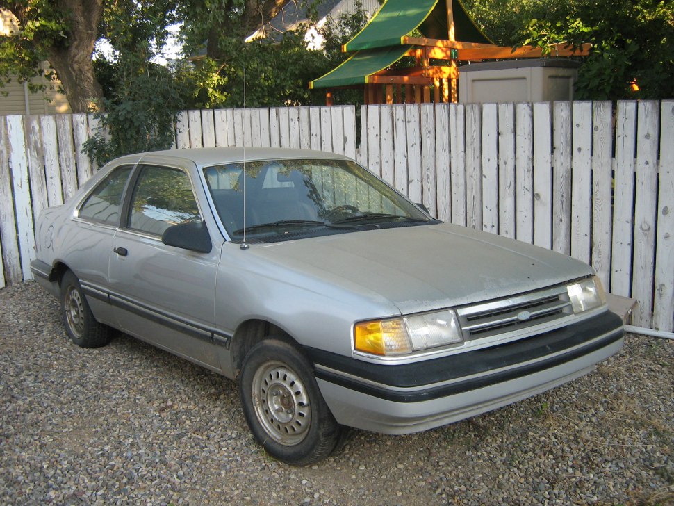 Silver vintage compact coupe front side profile with black trim