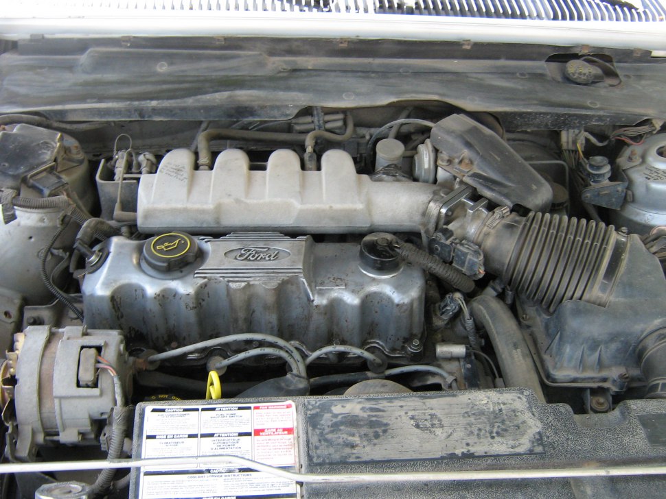 Close-up of inline-4 engine with air intake and Ford valve cover