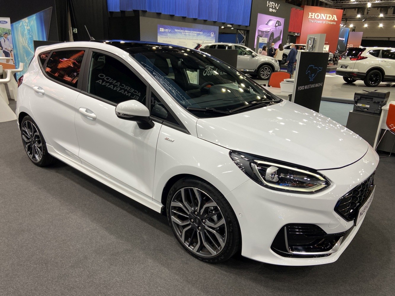 Modern headlights and multi-spoke alloy wheels on a 5-door hatchback