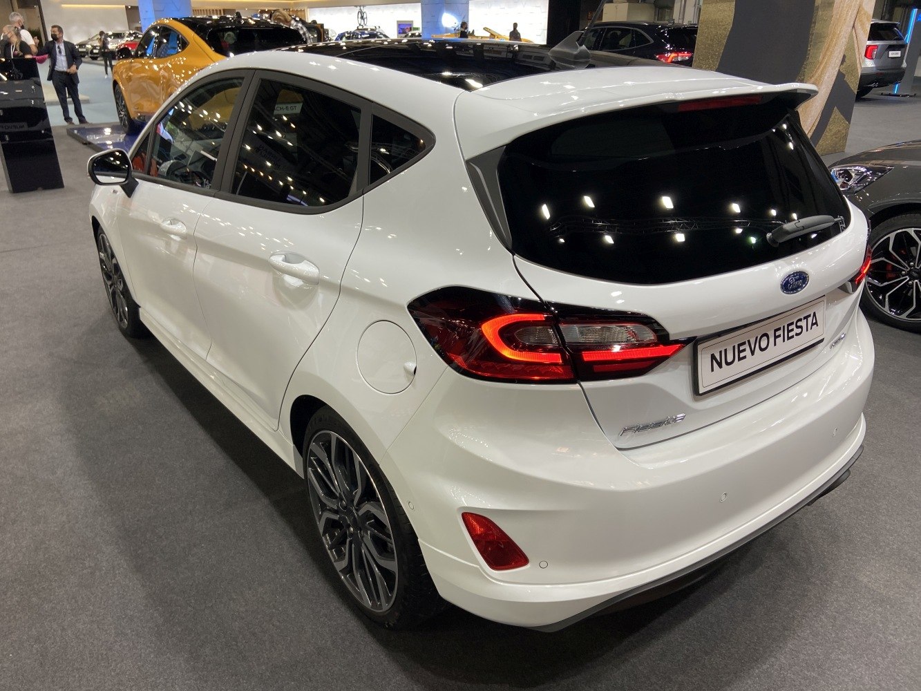 Rear view of white 5-door hatchback with LED tail lights and sporty lines