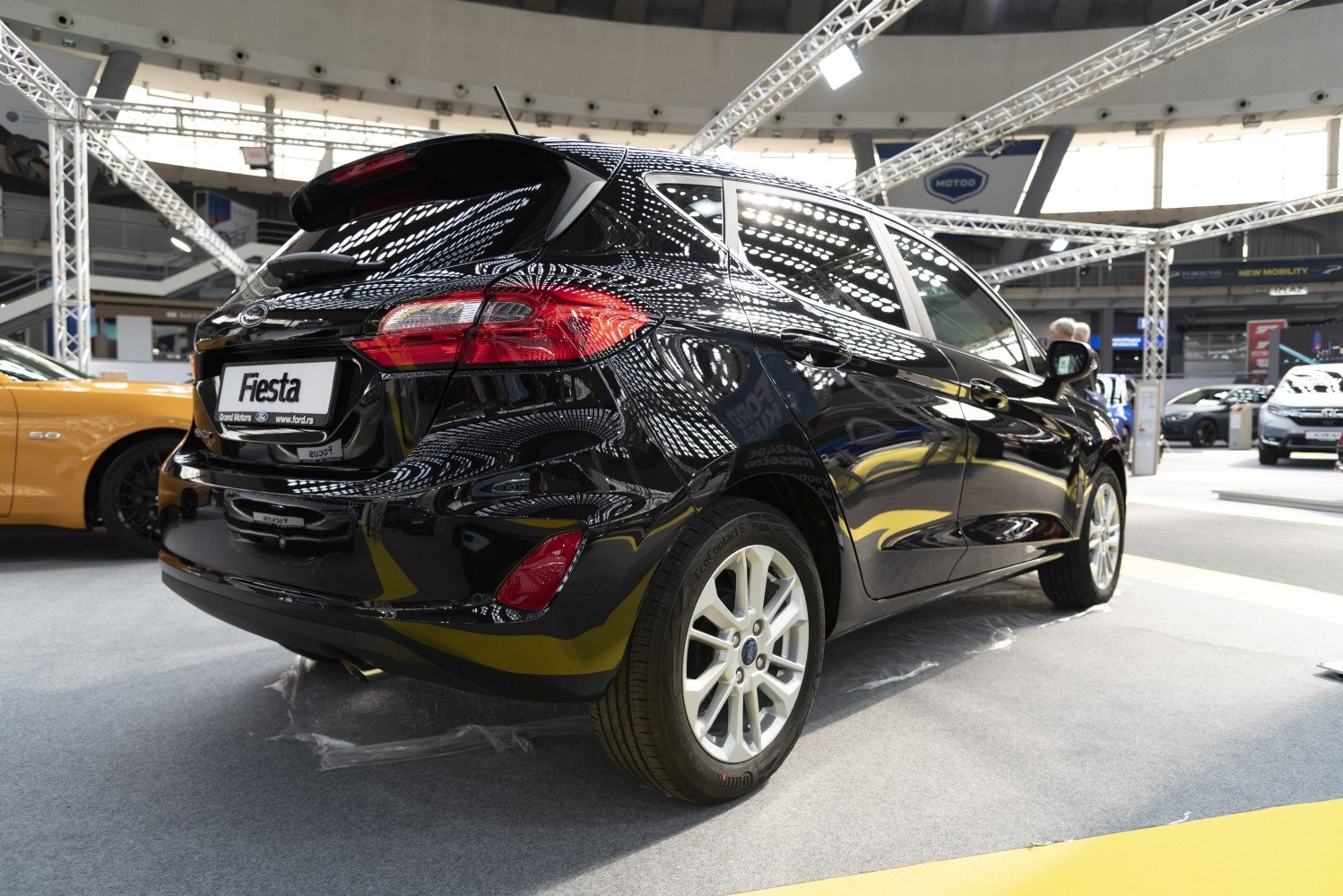 Rear view of a 5 door hatchback with modern tail lights and sleek black finish