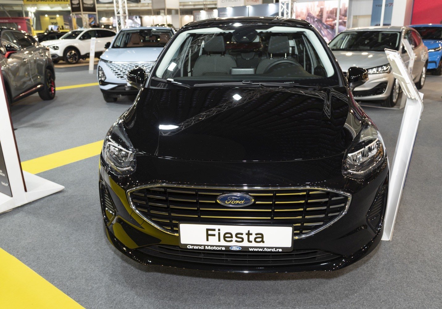 Close-up of front grille and LED headlights of a modern hatchback.