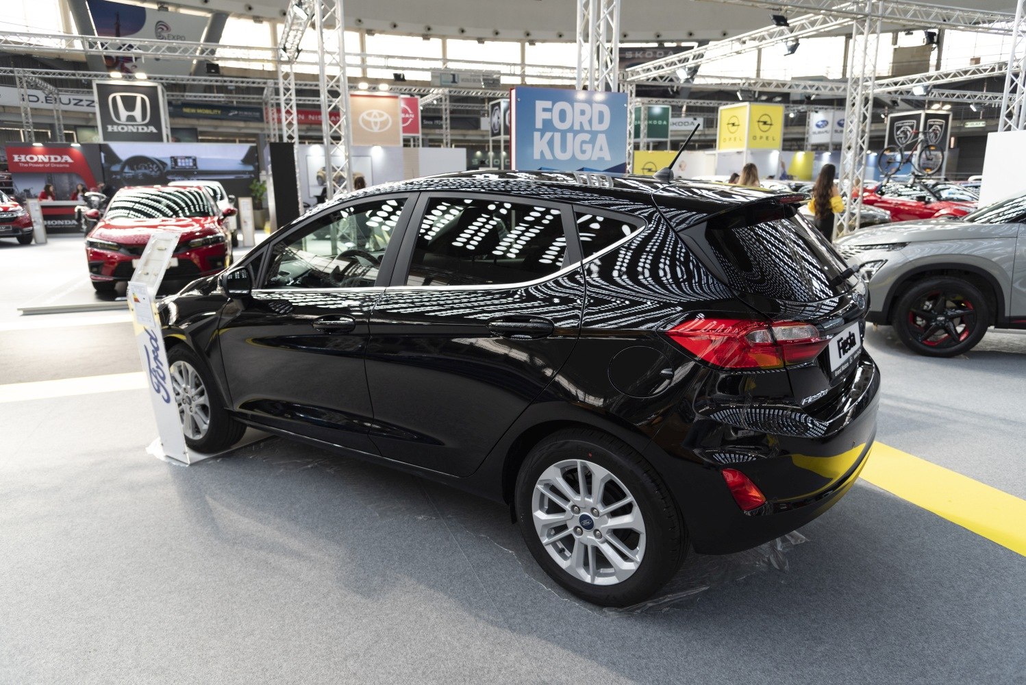 Black 5 door hatchback rear side view with sharp tail lights and clean design