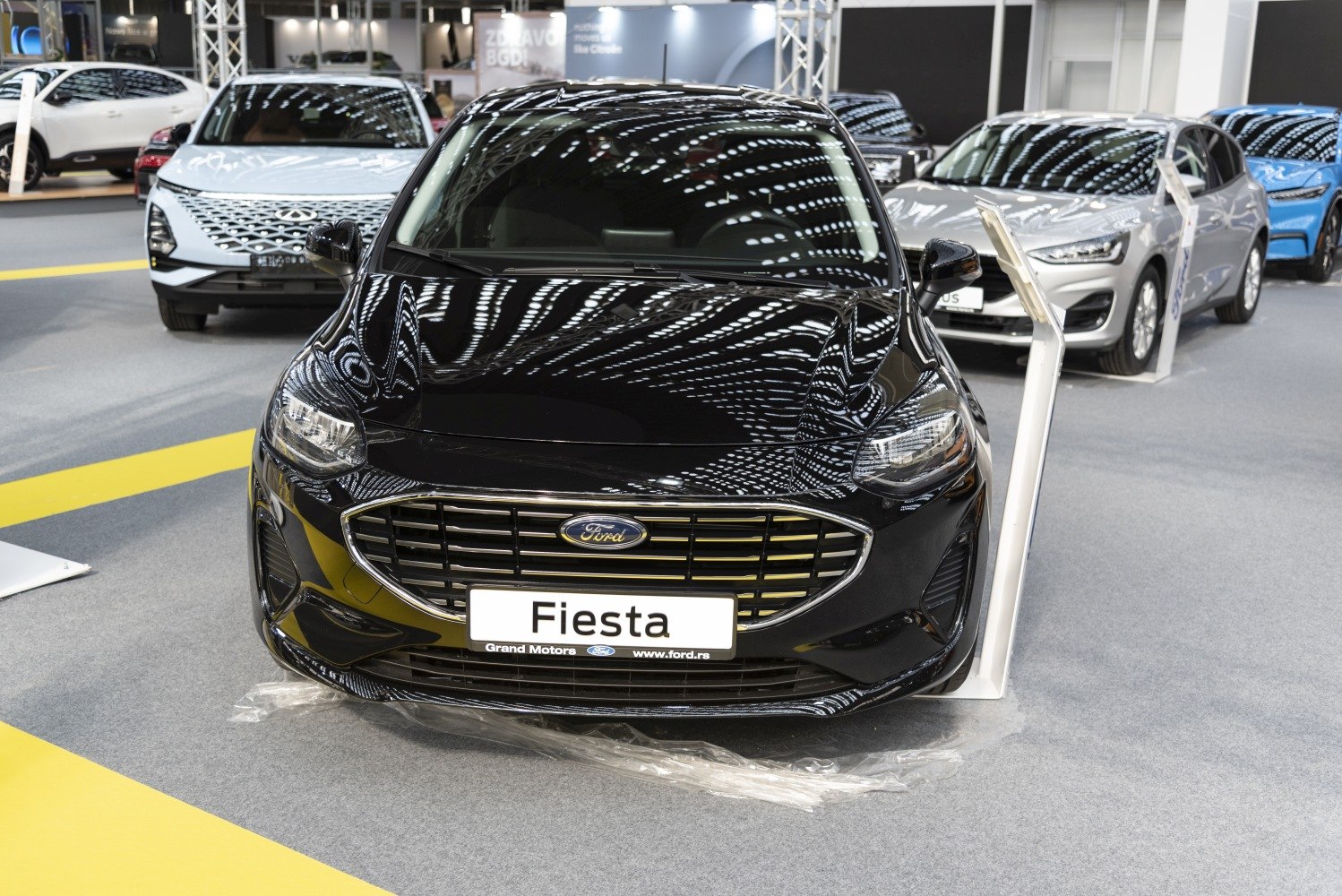 Front view showing grille, headlights, bumper of a 5-door hatchback