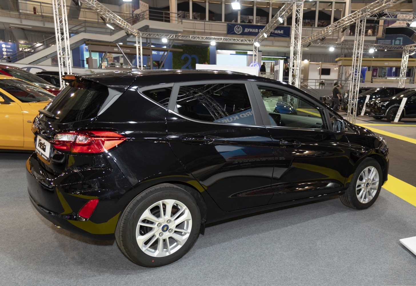 Rear-side view of black 5-door hatchback with alloy wheels and taillights