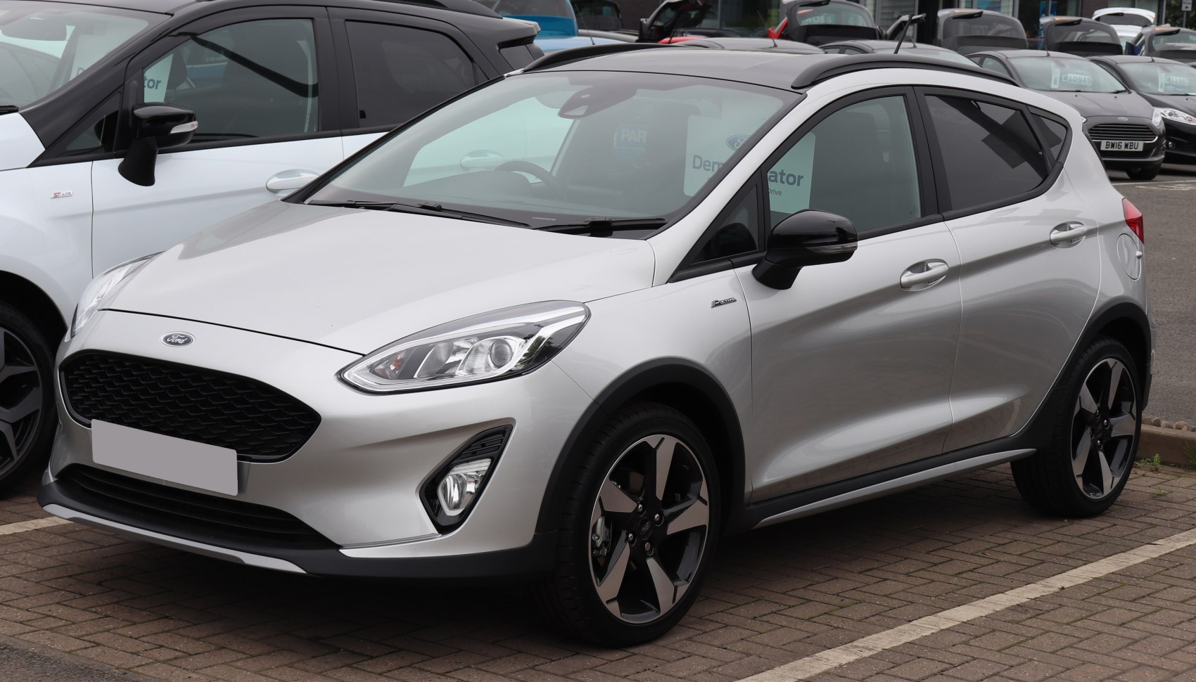 Silver hatchback with black grille and sporty alloy wheels