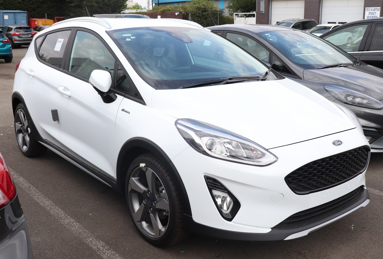 White compact crossover SUV with sporty wheels and modern headlights