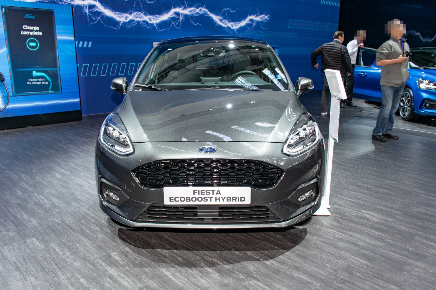 Front view with grill and headlights of a modern hybrid hatchback