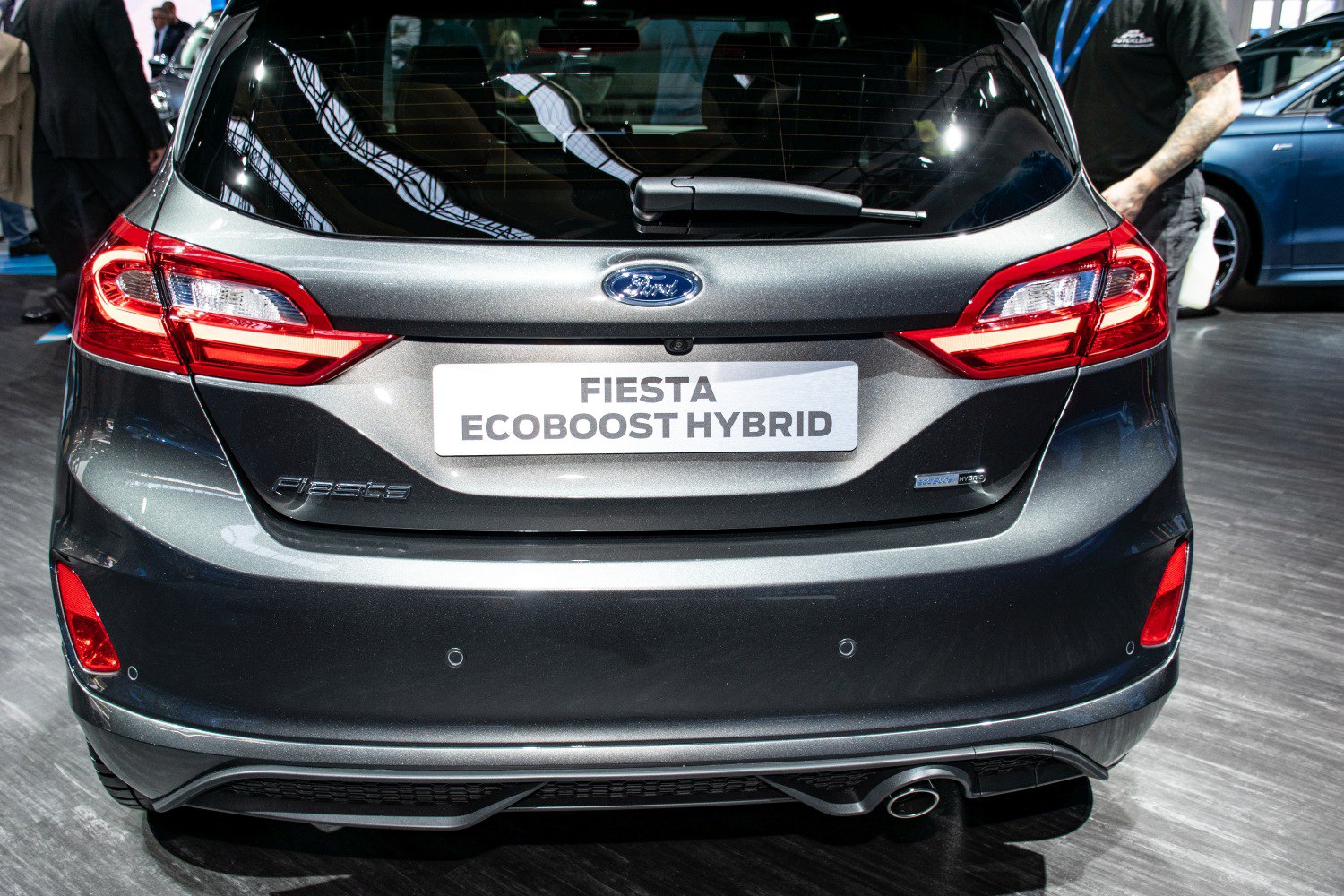 Rear view with taillights, EcoBoost Hybrid badge, rear wiper, and exhaust pipe